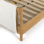 Bring a cozy hygge vibe to the bedroom with this textured Bowen Bed. Framed by light-finished solid oak, a sling-style bed features faux shearling head and foot boards -- sure to elevate any bedroom.   Queen Overall Dimensions: 64.25"w x 87.25"d x 48.00"h King Overall Dimensions: 80.25"w x 88.50"d x 48.00"h