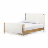 Bring a cozy hygge vibe to the bedroom with this textured Bowen Bed. Framed by light-finished solid oak, a sling-style bed features faux shearling head and foot boards -- sure to elevate any bedroom.   Queen Overall Dimensions: 64.25"w x 87.25"d x 48.00"h King Overall Dimensions: 80.25"w x 88.50"d x 48.00"h