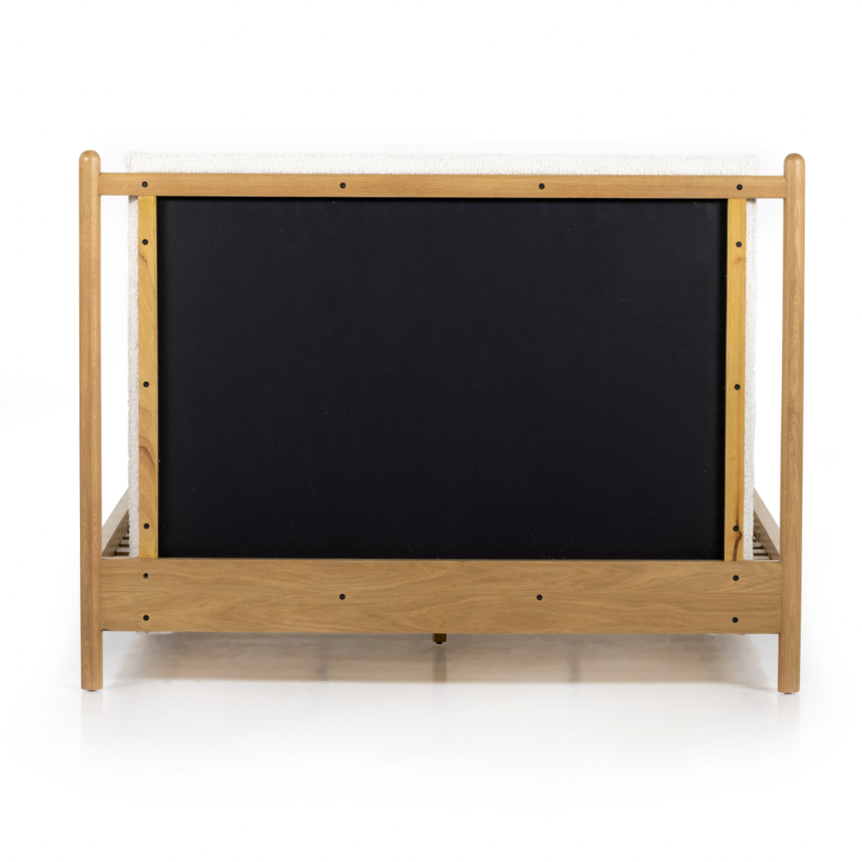 Bring a cozy hygge vibe to the bedroom with this textured Bowen Bed. Framed by light-finished solid oak, a sling-style bed features faux shearling head and foot boards -- sure to elevate any bedroom.   Queen Overall Dimensions: 64.25"w x 87.25"d x 48.00"h King Overall Dimensions: 80.25"w x 88.50"d x 48.00"h