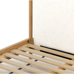 Bring a cozy hygge vibe to the bedroom with this textured Bowen Bed. Framed by light-finished solid oak, a sling-style bed features faux shearling head and foot boards -- sure to elevate any bedroom.   Queen Overall Dimensions: 64.25"w x 87.25"d x 48.00"h King Overall Dimensions: 80.25"w x 88.50"d x 48.00"h