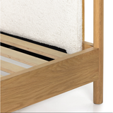 Bring a cozy hygge vibe to the bedroom with this textured Bowen Bed. Framed by light-finished solid oak, a sling-style bed features faux shearling head and foot boards -- sure to elevate any bedroom.   Queen Overall Dimensions: 64.25"w x 87.25"d x 48.00"h King Overall Dimensions: 80.25"w x 88.50"d x 48.00"h