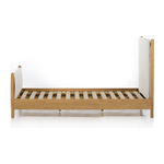 Bring a cozy hygge vibe to the bedroom with this textured Bowen Bed. Framed by light-finished solid oak, a sling-style bed features faux shearling head and foot boards -- sure to elevate any bedroom.   Queen Overall Dimensions: 64.25"w x 87.25"d x 48.00"h King Overall Dimensions: 80.25"w x 88.50"d x 48.00"h