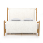 Bring a cozy hygge vibe to the bedroom with this textured Bowen Bed. Framed by light-finished solid oak, a sling-style bed features faux shearling head and foot boards -- sure to elevate any bedroom.   Queen Overall Dimensions: 64.25"w x 87.25"d x 48.00"h King Overall Dimensions: 80.25"w x 88.50"d x 48.00"h