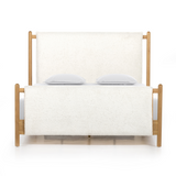 Bring a cozy hygge vibe to the bedroom with this textured Bowen Bed. Framed by light-finished solid oak, a sling-style bed features faux shearling head and foot boards -- sure to elevate any bedroom.   Queen Overall Dimensions: 64.25"w x 87.25"d x 48.00"h King Overall Dimensions: 80.25"w x 88.50"d x 48.00"h