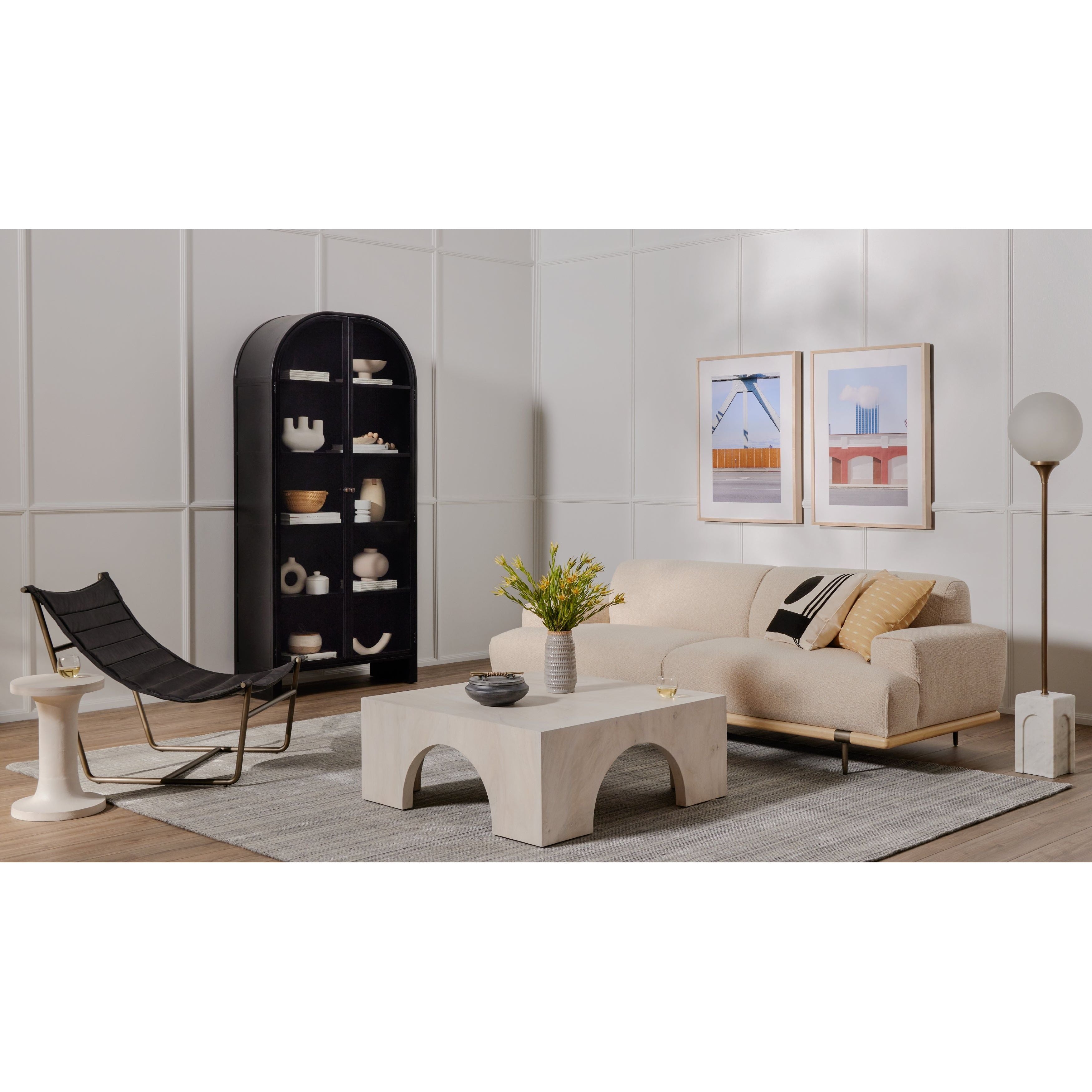 Store it in style with this Breya Cabinet - Black. Made from black-finished iron, beautifully arched cabinetry features glass-front doors, ideal for storing and displaying favorite books, photos, keepsakes, and more.  Overall Dimensions: 40.00"w x 16.25"d x 86.75"h