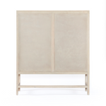 Natural mango wood encases textural cane doors which open to reveal spacious interior storage with this Caprice Cabinet - Natural Mango. A simple Parsons-style base keeps things open and airy for any dining room, bedroom, or other area.   Overall Dimensions: 59.00"w x 17.00"d x 69.00"h
