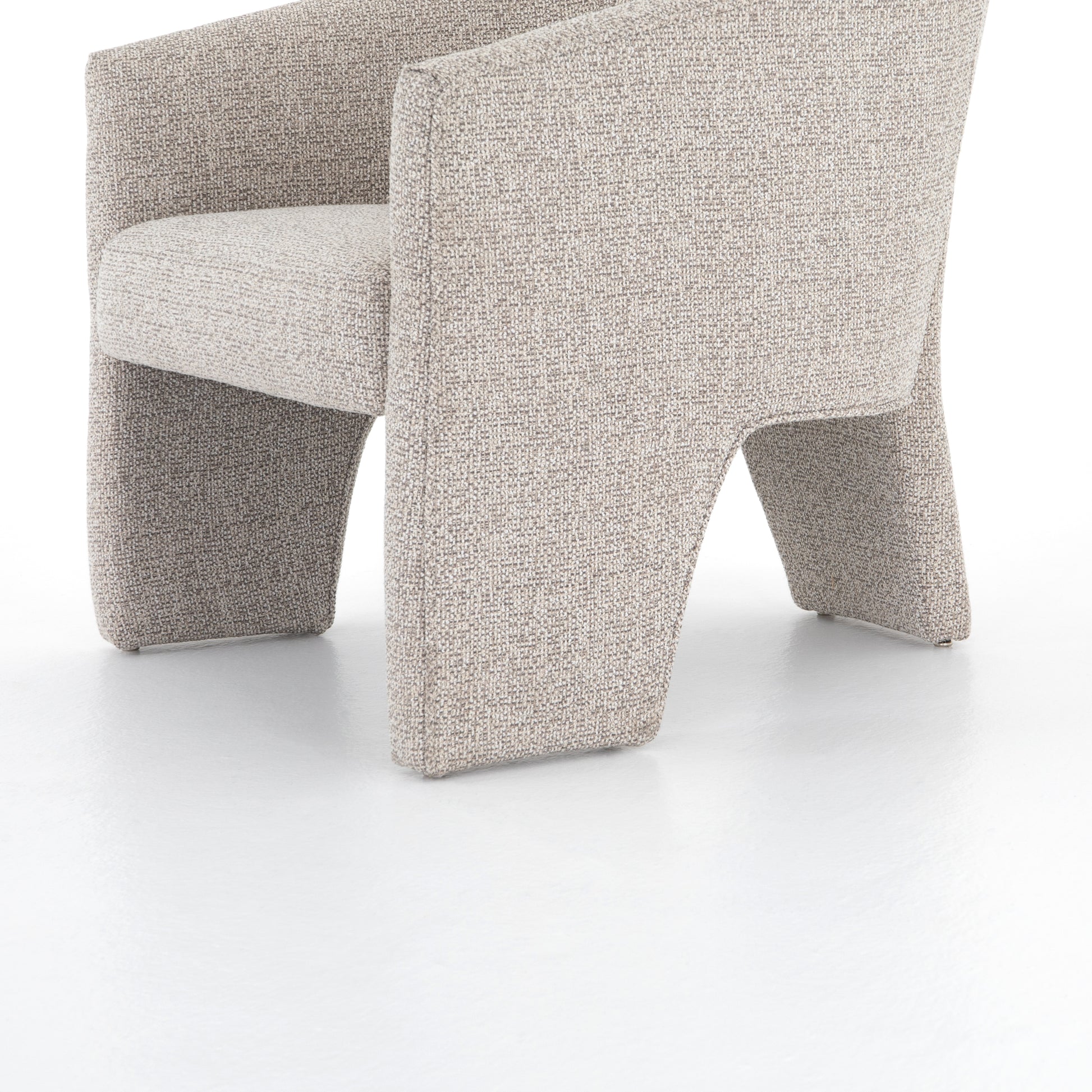 This Fae Chair - Bellamy Storm is well-tailored and stylistically unique. The Italian boucle lends a high-fashion feel to a cleverly constructed three-legged design.  Overall Dimensions: 30.25"w x 29.50"d x 29.50"h