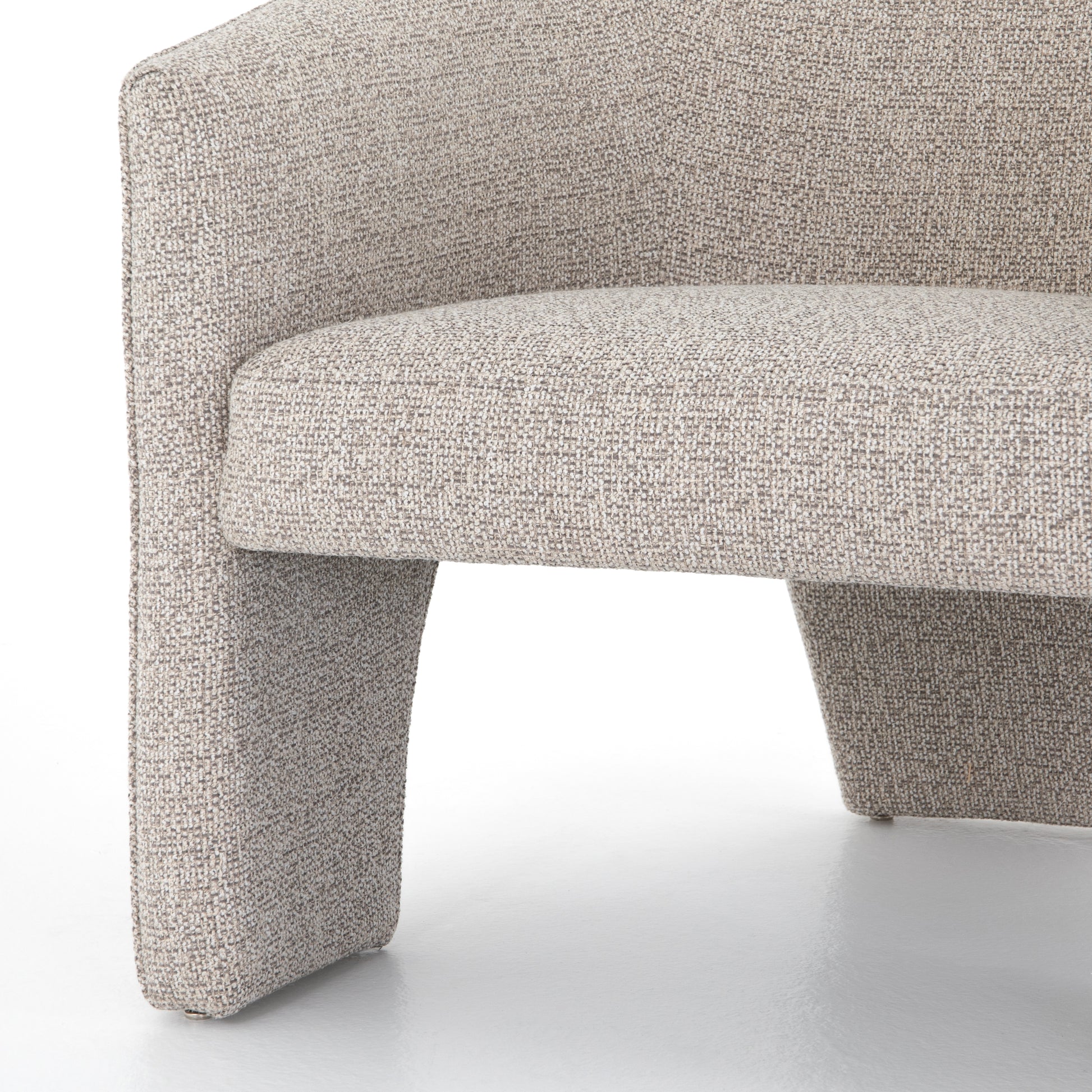 This Fae Chair - Bellamy Storm is well-tailored and stylistically unique. The Italian boucle lends a high-fashion feel to a cleverly constructed three-legged design.  Overall Dimensions: 30.25"w x 29.50"d x 29.50"h