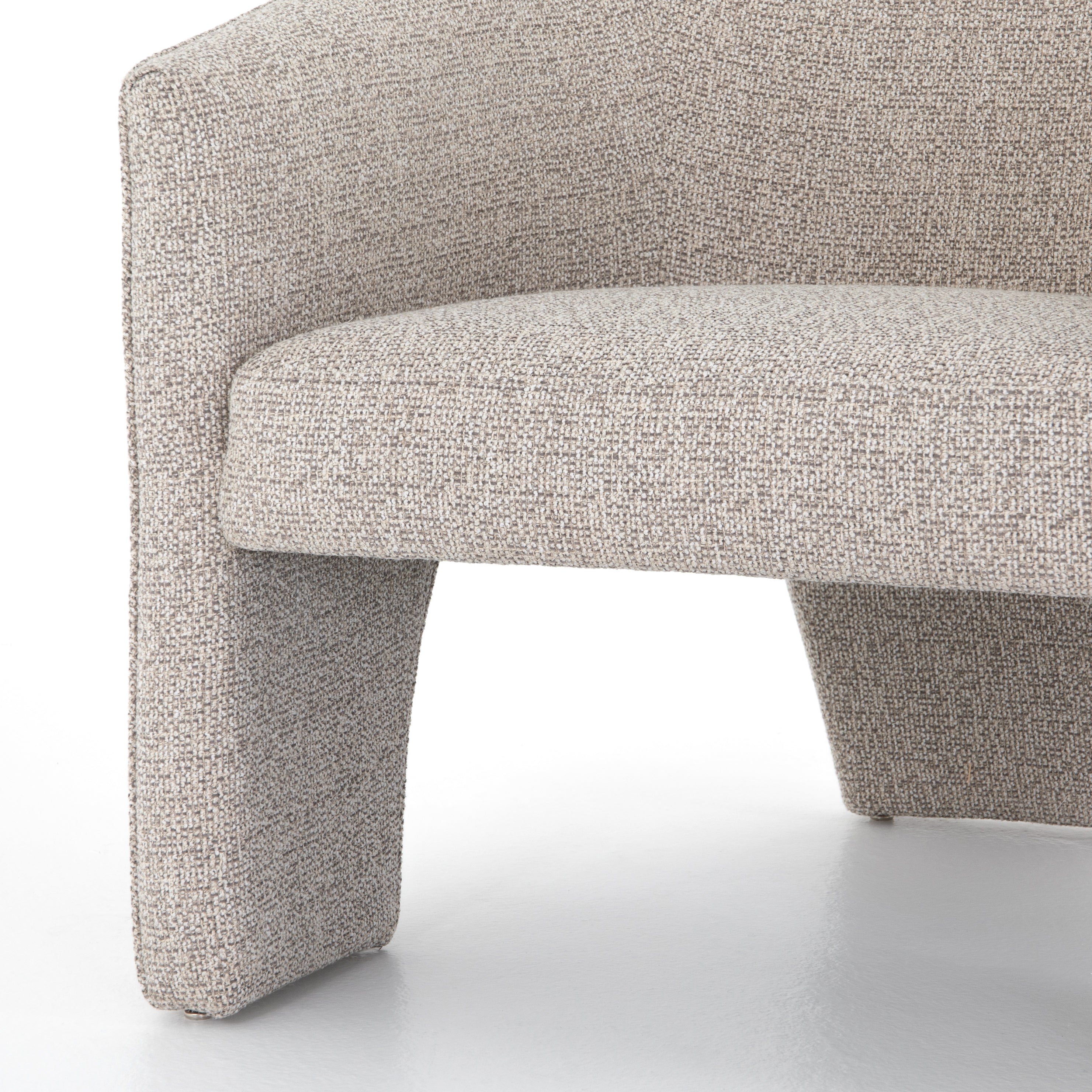 This Fae Chair - Bellamy Storm is well-tailored and stylistically unique. The Italian boucle lends a high-fashion feel to a cleverly constructed three-legged design.  Overall Dimensions: 30.25"w x 29.50"d x 29.50"h