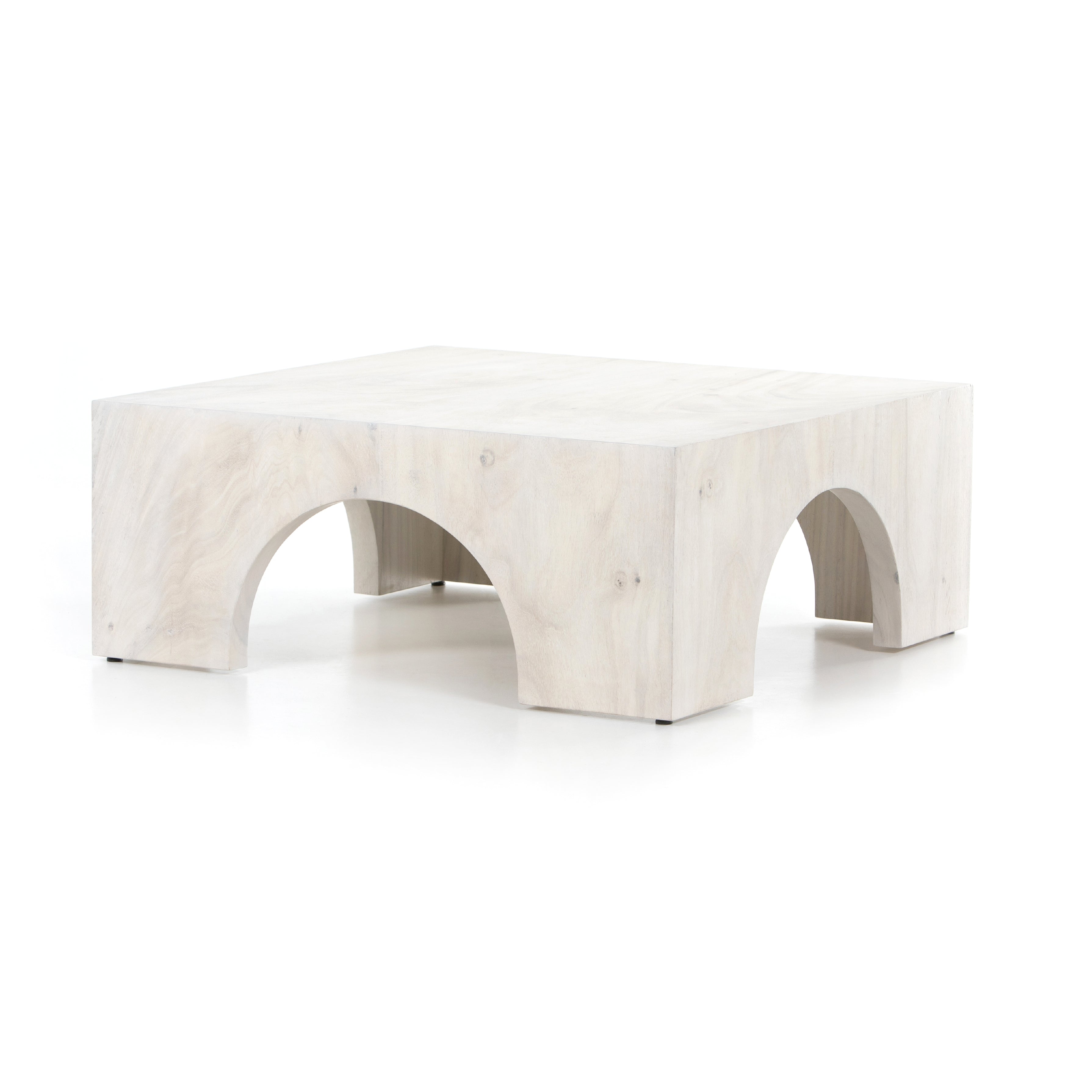 We love how clean and simple this Fausto Coffee Table -  Bleached Guanacaste is. Made from beautiful bleached Guanacaste, shapely arches and block corners speak to the architectural inspiration behind this eye-catching coffee table.  Overall Dimensions: 40.00"w x 40.00"d x 16.00"h