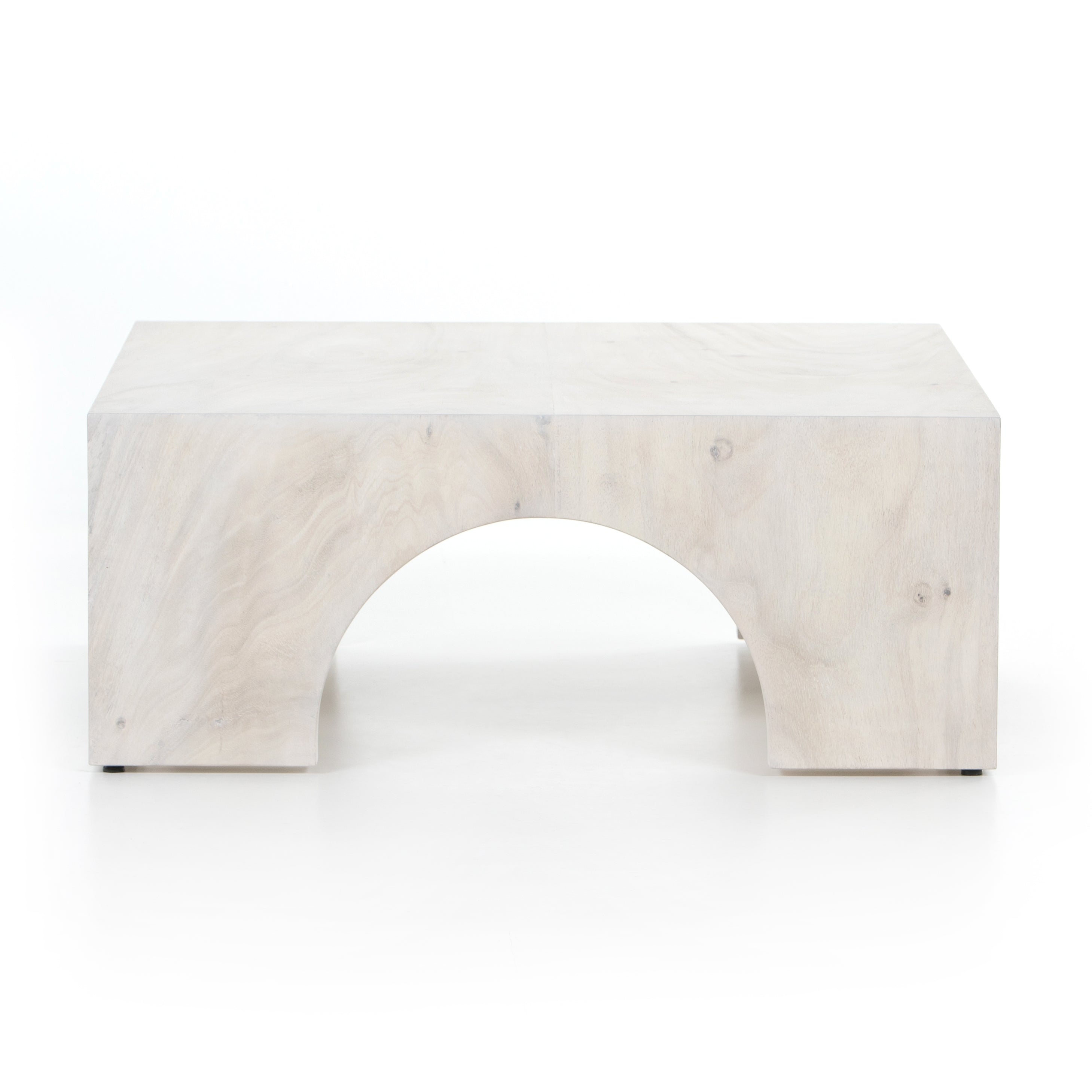 We love how clean and simple this Fausto Coffee Table -  Bleached Guanacaste is. Made from beautiful bleached Guanacaste, shapely arches and block corners speak to the architectural inspiration behind this eye-catching coffee table.  Overall Dimensions: 40.00"w x 40.00"d x 16.00"h