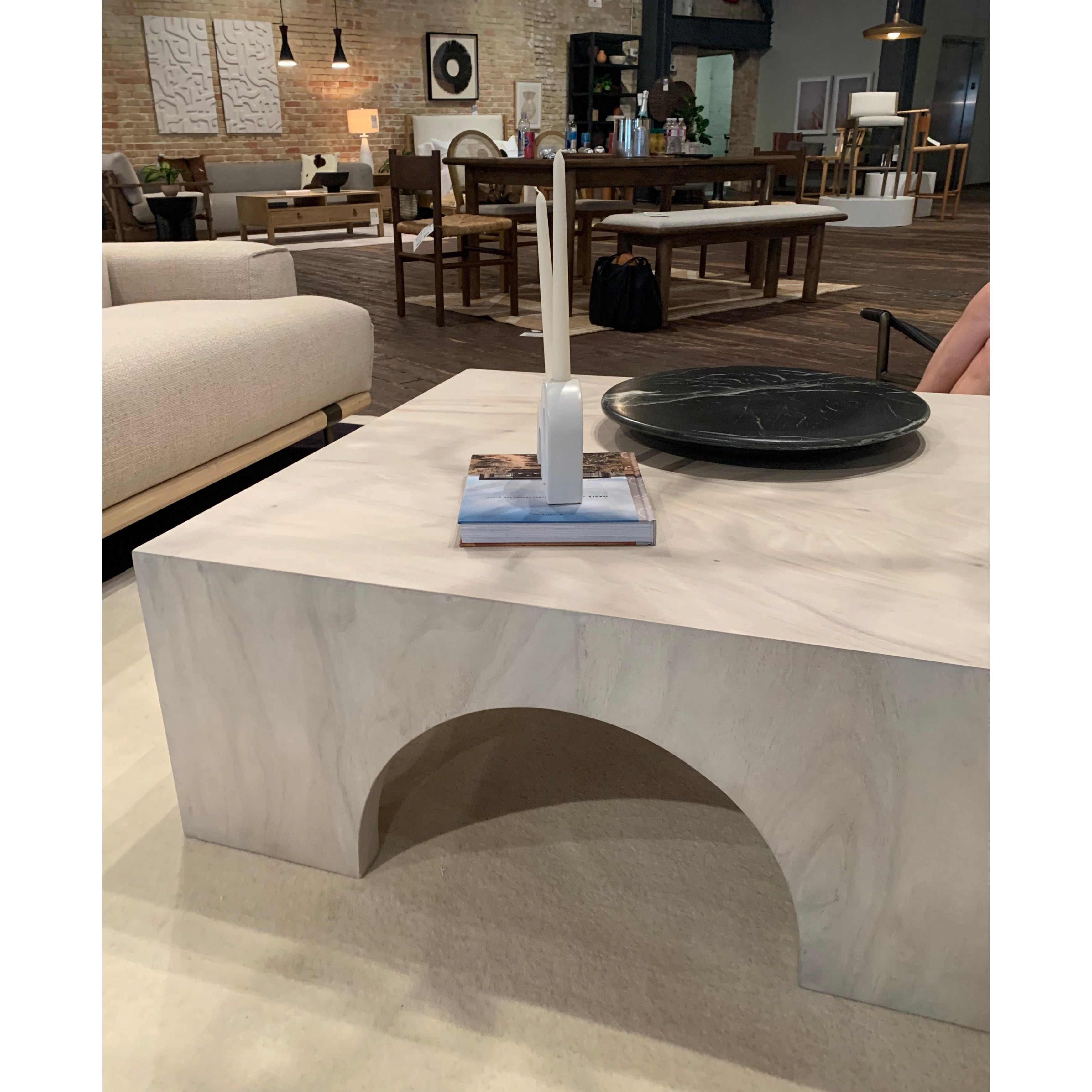 We love how clean and simple this Fausto Coffee Table -  Bleached Guanacaste is. Made from beautiful bleached Guanacaste, shapely arches and block corners speak to the architectural inspiration behind this eye-catching coffee table.  Overall Dimensions: 40.00"w x 40.00"d x 16.00"h