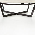 We love the textured top and geometric base of this Felix Round Coffee Table - Sandblasted White Marble. Place in your living room or lounge area to bring a sophisticated look to the space.  Overall Dimensions: 48.00"w x 48.00"d x 15.00"h Colors: Rustic Fossil, Sandblasted White Marble Materials: Iron, Marble Weight: 189.6 lb