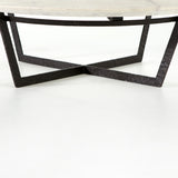 We love the textured top and geometric base of this Felix Round Coffee Table - Sandblasted White Marble. Place in your living room or lounge area to bring a sophisticated look to the space.  Overall Dimensions: 48.00"w x 48.00"d x 15.00"h Colors: Rustic Fossil, Sandblasted White Marble Materials: Iron, Marble Weight: 189.6 lb
