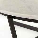 We love the textured top and geometric base of this Felix Round Coffee Table - Sandblasted White Marble. Place in your living room or lounge area to bring a sophisticated look to the space.  Overall Dimensions: 48.00"w x 48.00"d x 15.00"h Colors: Rustic Fossil, Sandblasted White Marble Materials: Iron, Marble Weight: 189.6 lb