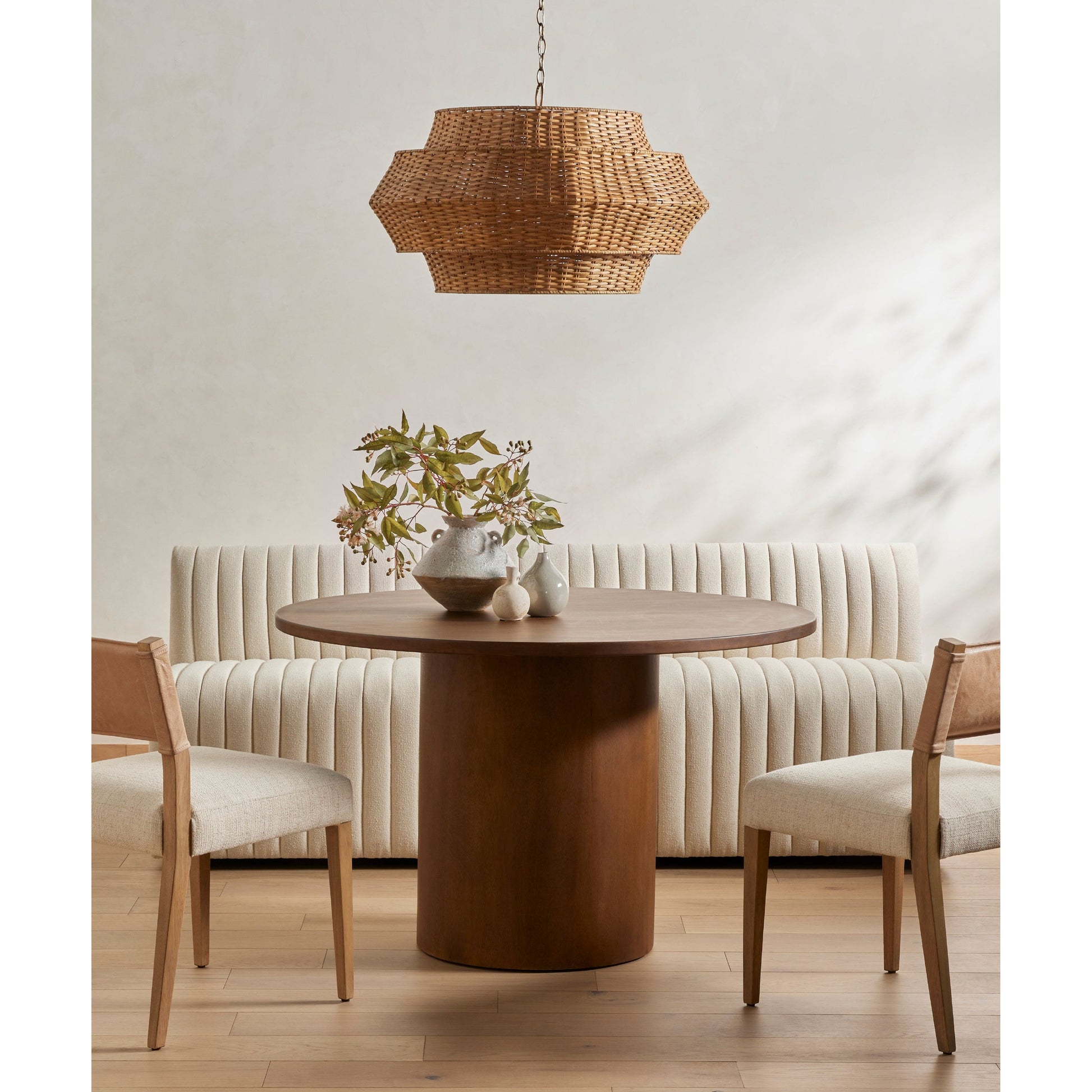 We love the mixed materials found on this Ferris Dining Chair - Winchester Beige. Solid parawood forms a slight, simple frame for squared seating upholstered in high-performance fabric. Tan top-grain leather backing takes this modern-minded dining chair to the next level.  Overall Dimensions: 20.00"w x 21.75"d x 32.00"h