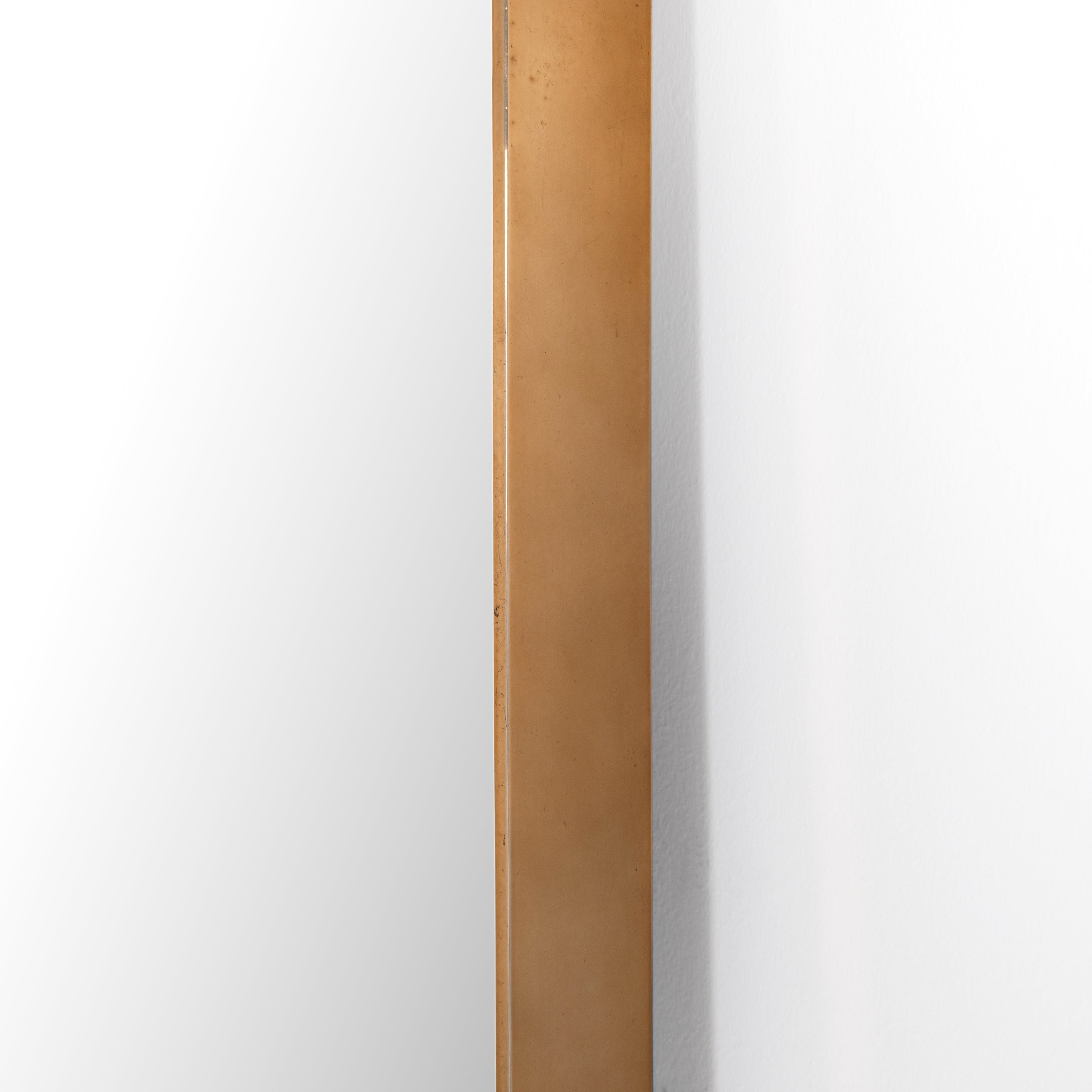 This Georgina Floor Mirror has a beautiful arch with a rose gold-finish aluminum frame. This will be the go-to mirror at home to try on your newest shopping haul or take that shameless selfie in.  Overall Dimensions: 32.00"w x 2.00"d x 80.00"h Colors: Polished Brass, Mirror Materials: Aluminum, Mirror Weight: 110  Please allow 3-4 weeks on shipment for these items. 