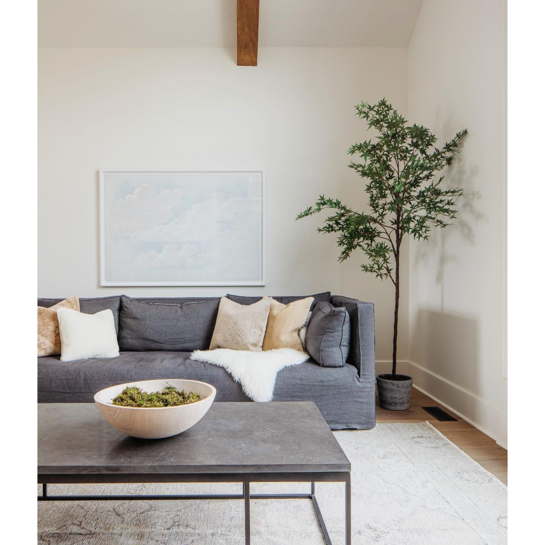 Spare beauty, casual elegance with the Harlow Bluestone Small Coffee Table. A gunmetal Parson's base with hand-rubbed, dimensional edges supports a rough-hewn bluestone slab that feels found and perfectly placed.  Size: 60"w x 28"d x 17"h Materials: Iron, Limestone
