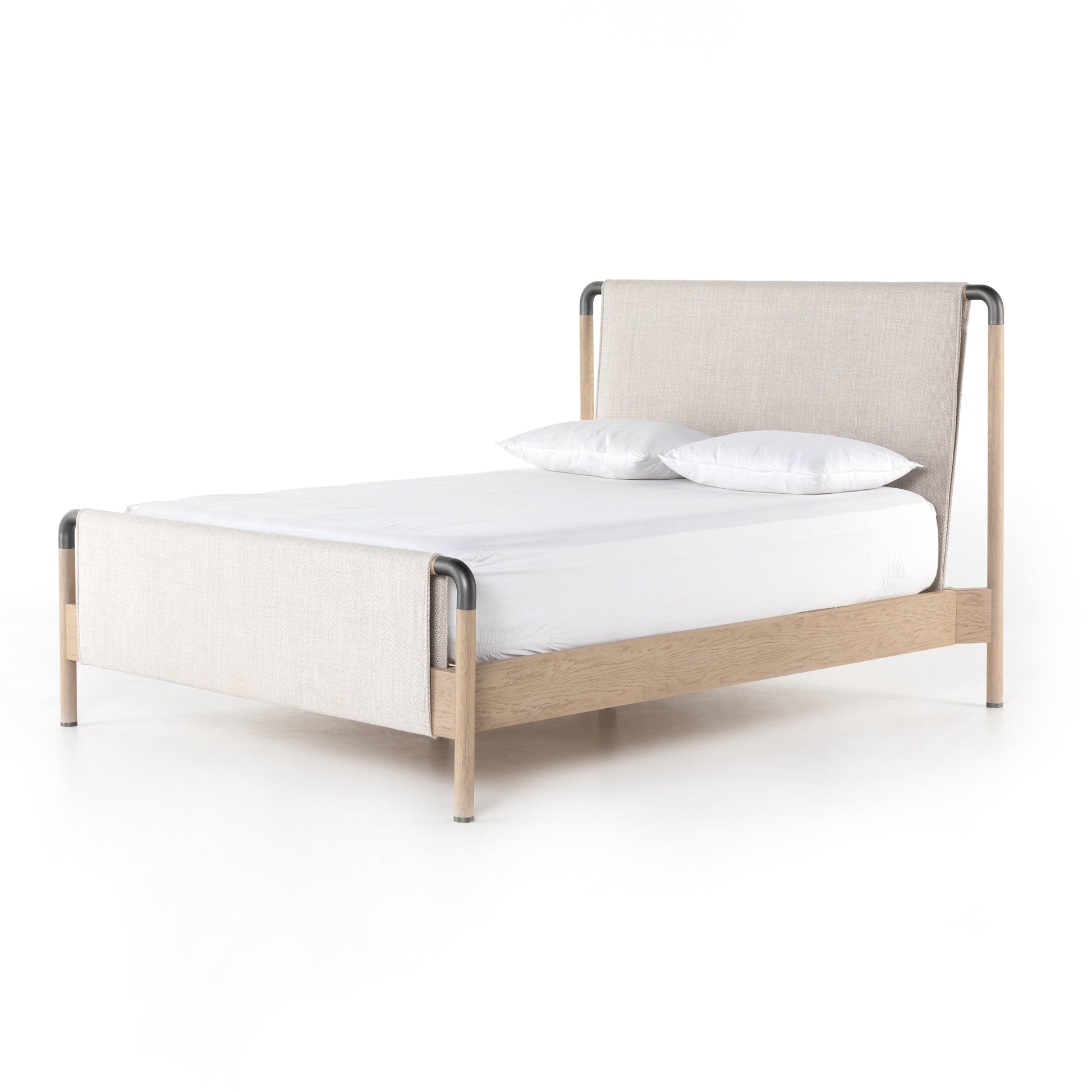 We love the mixed materials of this Harriet Bed. Framed by solid oak with rounded iron corners, an upholstered, sling-style headboard brings a light, modern vibe to any bedroom. Queen Overall Dimensions: 70.50"w x 88.50"d x 51.00"h  King Overall Dimensions: 86.50"w x 88.50"d x 51.00"h
