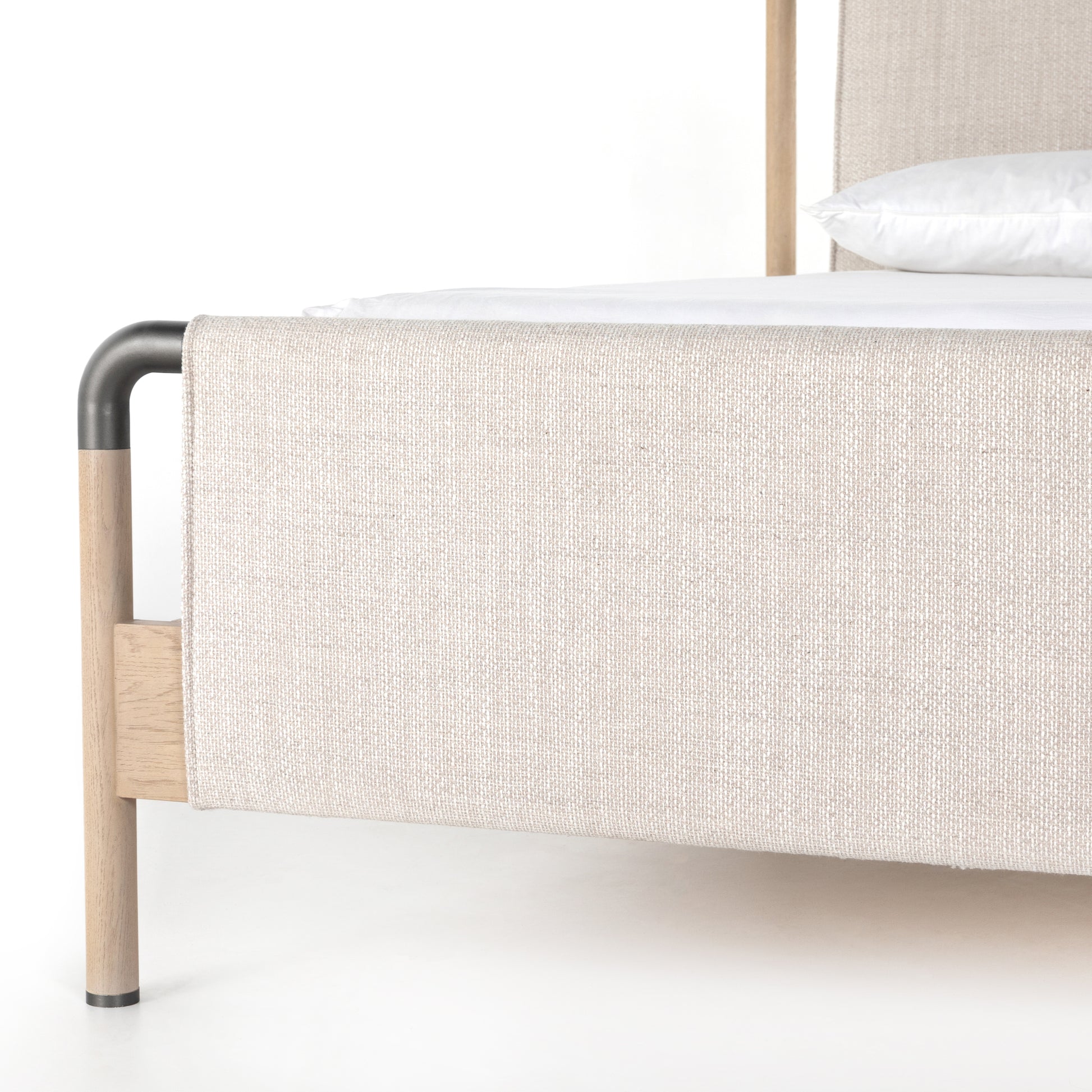 We love the mixed materials of this Harriet Bed. Framed by solid oak with rounded iron corners, an upholstered, sling-style headboard brings a light, modern vibe to any bedroom. Queen Overall Dimensions: 70.50"w x 88.50"d x 51.00"h  King Overall Dimensions: 86.50"w x 88.50"d x 51.00"h