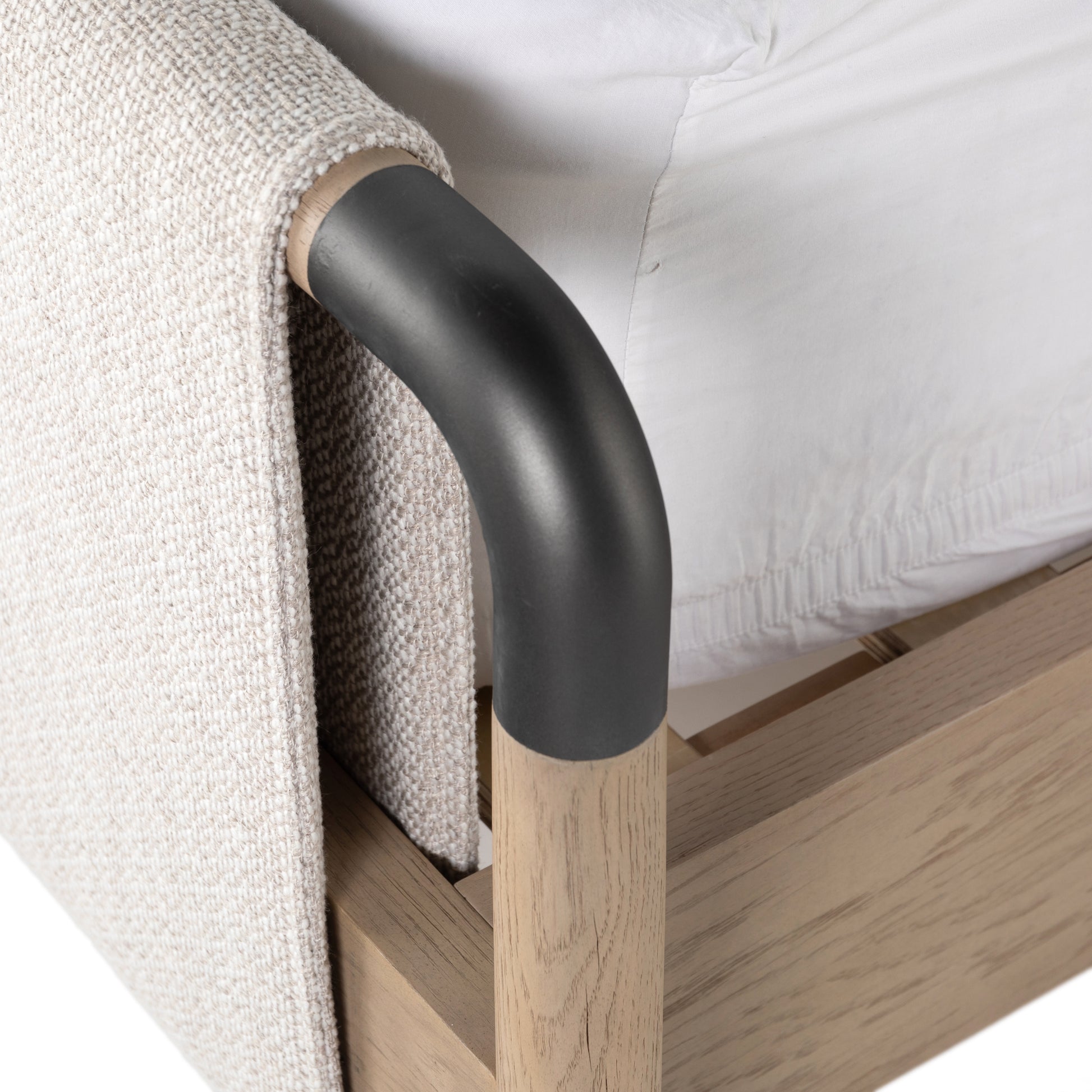 We love the mixed materials of this Harriet Bed. Framed by solid oak with rounded iron corners, an upholstered, sling-style headboard brings a light, modern vibe to any bedroom. Queen Overall Dimensions: 70.50"w x 88.50"d x 51.00"h  King Overall Dimensions: 86.50"w x 88.50"d x 51.00"h