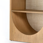 We are obsessed with the natural cane paneling on this Higgs Bookcase - Honey Oak Veneer. The tall, clean frame has four shelves perfect for showcasing your favorite books, family photos, or family heirlooms   Overall Dimensions: 34.75"w x 18.00"d x 84.00"h