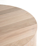 Stunning forces of nature are captured in a walnut-finished coffee table, as spalted primavera and yukas woods are hand-shaped into a cylindrical silhouette. Reflective of woods' natural character, a slight color variance is possible.   Overall Dimensions: 40"w x 40"d x 15"h  Colors: Gunmetal, Ashen Walnut Materials: Iron, Thick Walnut Veneer