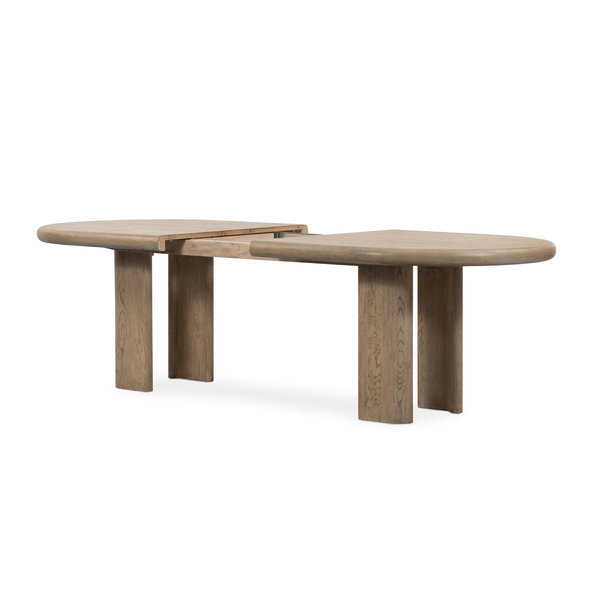 The rounded edges of this Jaylen Extension Dining Table - Yucca Oak are so dreamy. Made from solid oak with an oak veneer, this both a kid friendly and beautiful table to add to any dining room or kitchen area! The extension piece allows entertainment perfect for a few friends or the whole family!   Overall Dimensions: 87.00"w x 42.00"d x 30.00"h