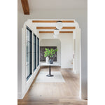 French-industrial meets bistro table. Detailed, 8-sided cast iron pedestal supports a dramatic white marble top with bull-nosed edge.  Overall Size: 36.00"w x 36.00"d x 31.00"h  Colors: Carbon Wash, White Marble Materials: Iron, Marble