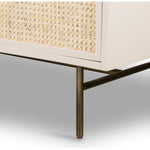 Bring a light look to bedroom styling with this Luella 6 Drawer Dresser - Matte Alabaster. A lacquered six-drawer dresser features woven cane panels and half-moon hardware finished in an aged brass for a beautiful + functional dresser in any bedroom!  Overall Dimensions: 64.00"w x 19.00"d x 33.50"h