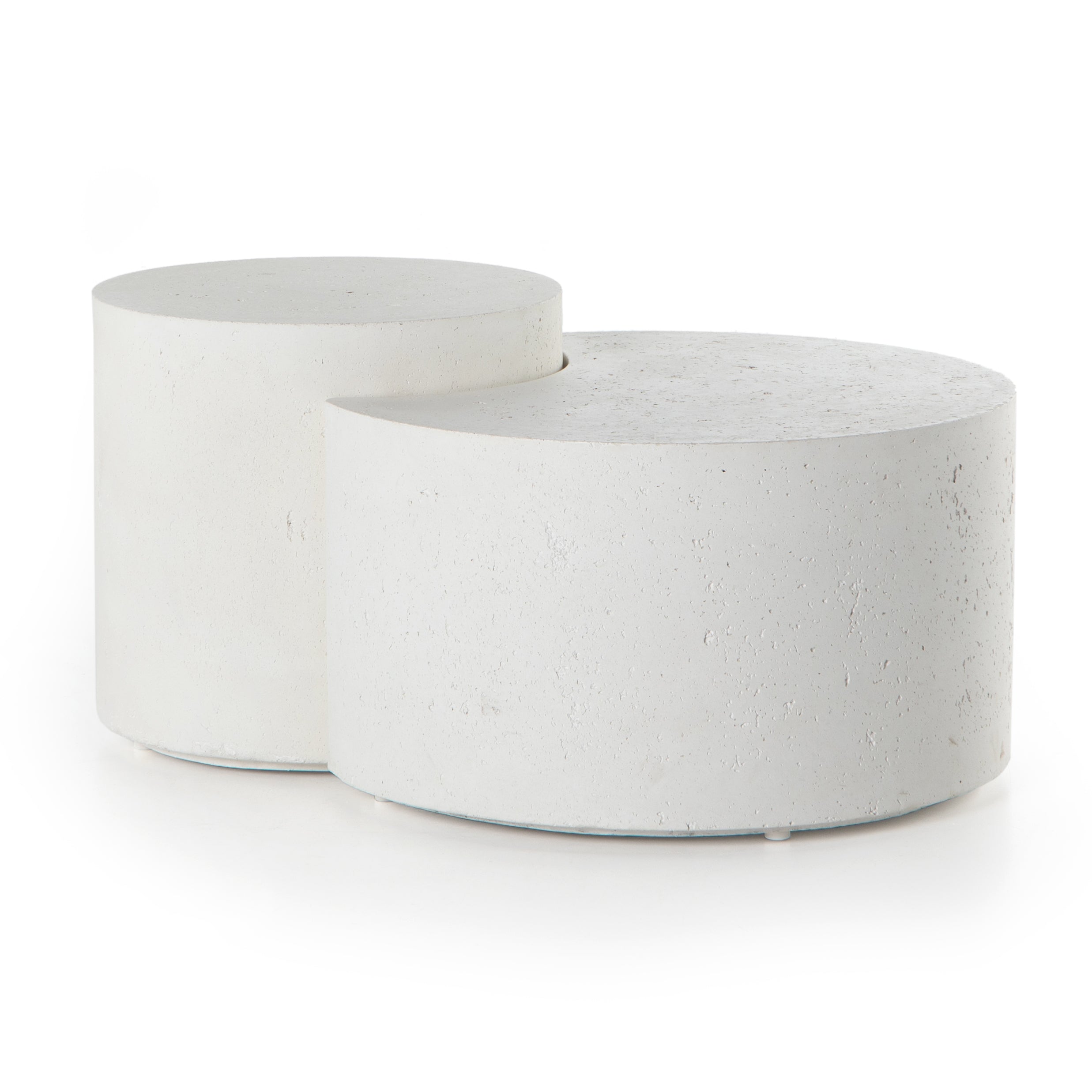 Made from white-finished concrete with deep, textured pitting, this Meza Nesting Coffee Table - Textured White is sturdy and beautiful. Inspired by mid-century coral décor, this nesting coffee table features two tiers for a layered look with modernity.  Overall Dimensions: 43.75"w x 28.25"d x 19.00"h