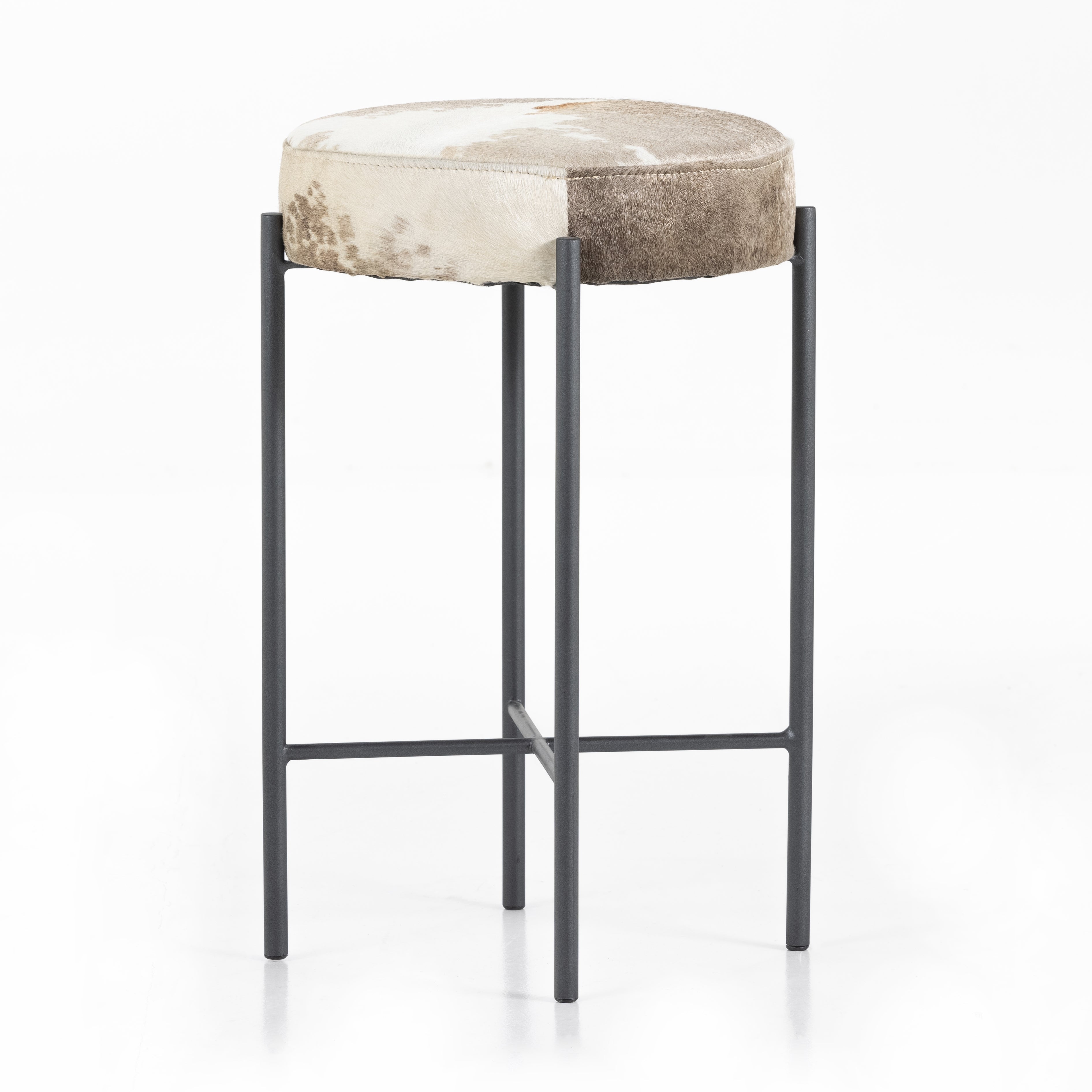 The Nocona Speckled Hide Bar and Counter stool is modern minimalist to a T. Slim and airy, gunmetal-finished iron legs form a cradle-style frame for speckled hide seating, perfectly sized for the counter or bar. Each hide will be unique and will vary. Amethyst Home provides interior design, new home construction design consulting, vintage area rugs, and lighting in the Los Angeles metro area.