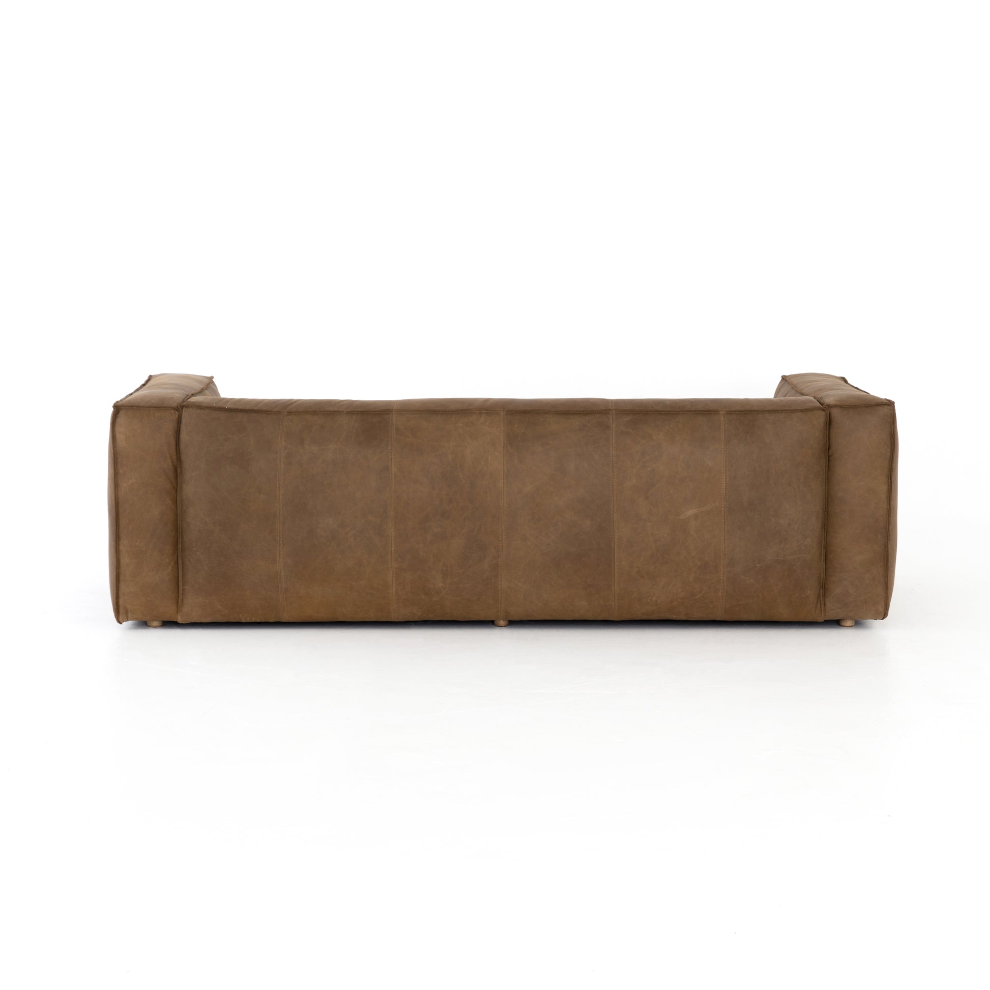 Sophisticated Italian styling with distinctly casual appeal is found in this Nolita Reverse Stitch Sofa - Natural Washed Sand. Top-grain leather takes on a natural sand color with contrast stitching along the welt, sure to elevate the space for any living room.   Overall Dimensions: 99.25"w x 43.00"d x 28.75"h