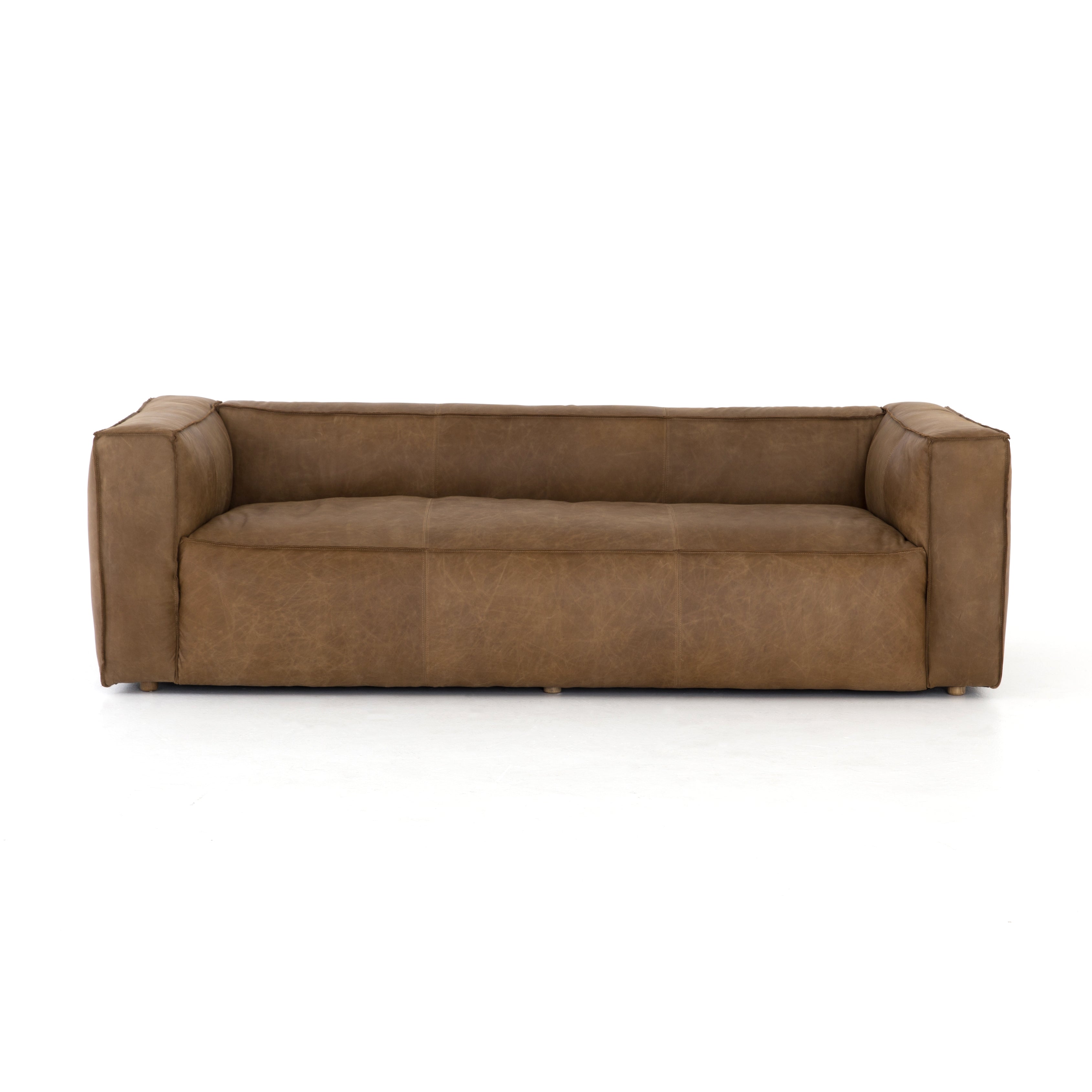 Sophisticated Italian styling with distinctly casual appeal is found in this Nolita Reverse Stitch Sofa - Natural Washed Sand. Top-grain leather takes on a natural sand color with contrast stitching along the welt, sure to elevate the space for any living room.   Overall Dimensions: 99.25"w x 43.00"d x 28.75"h