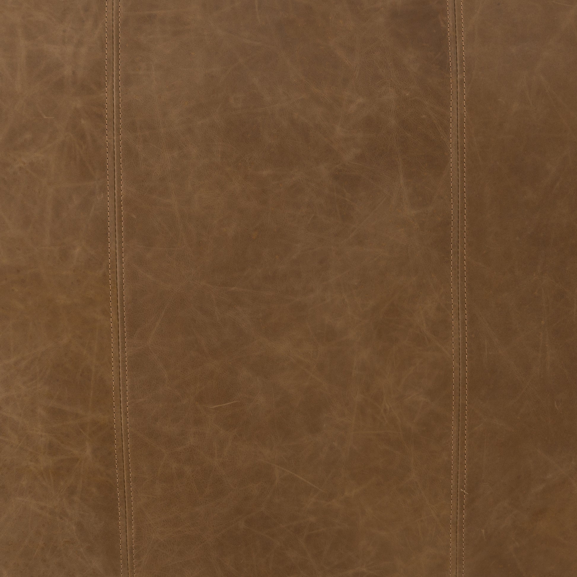 Sophisticated Italian styling with distinctly casual appeal is found in this Nolita Reverse Stitch Sofa - Natural Washed Sand. Top-grain leather takes on a natural sand color with contrast stitching along the welt, sure to elevate the space for any living room.   Overall Dimensions: 99.25"w x 43.00"d x 28.75"h