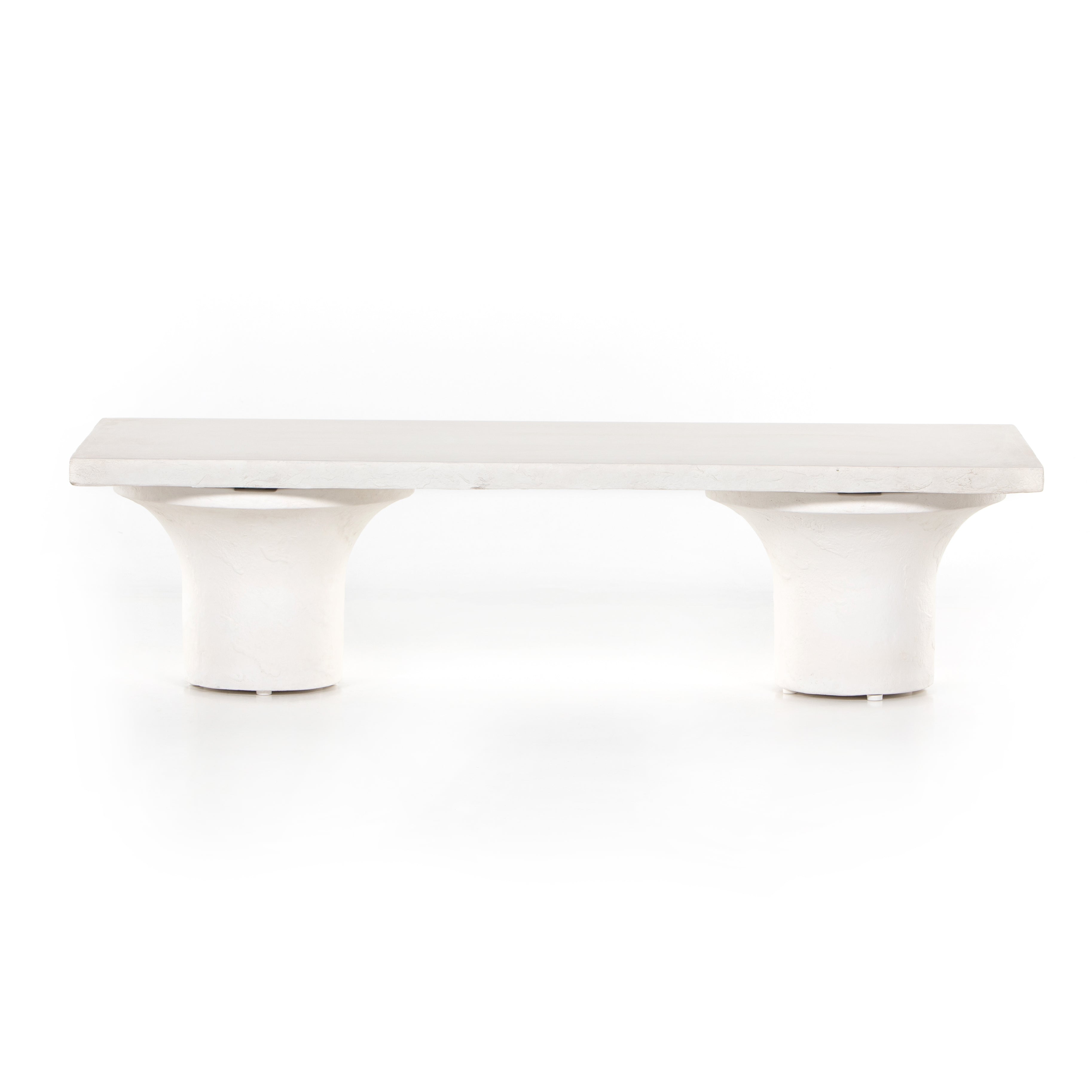 Make a monolithic statement with this Parra Coffee Table - Plaster Molded Concrete. Made from plaster-molded concrete, the pedestal-style legs support a rectangular tabletop of smooth, white-finished concrete, for a clean, adobe-inspired look.  Overall Dimensions: 59.75"w x 24.00"d x 15.00"h