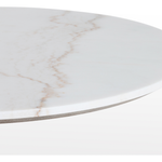 Featuring Powell 42" Dining Table - White Marble by Four Hands at Amethyst Home. We love the mixed materials found in this Powell Dining Table - White Marble. Classic tulip shaping is recast with a rustic black iron base and rounded top of white marble - a perfect addition to any dining room or kitchen! 
Overall Dimensions: 42"W x 42"L x 29.50"H
Colors: Dark R. Amethyst Home provides interior design, new home construction design consulting, vintage area rugs, and lighting in the Boston metro area.