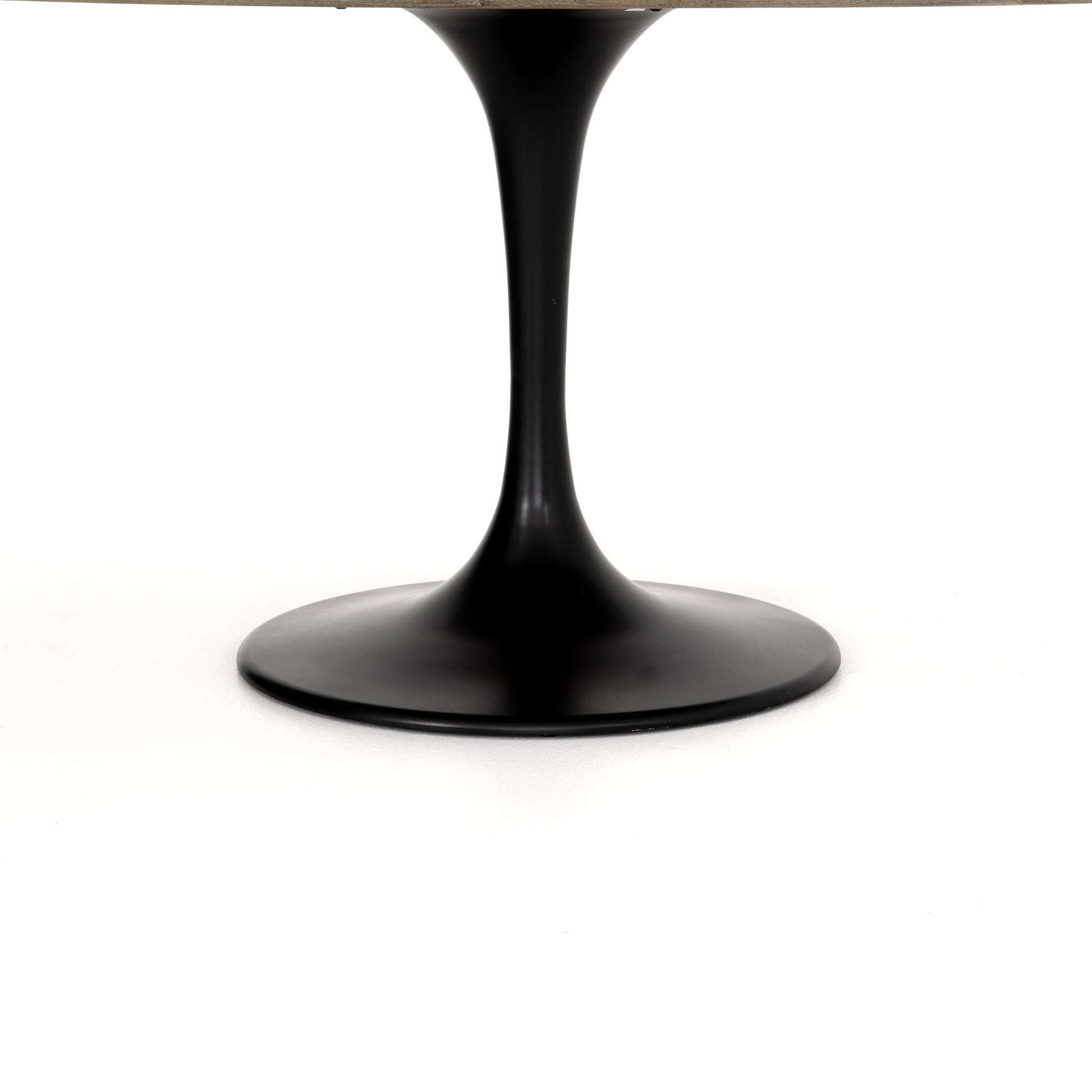 We love the mixed materials found in this Powell Dining Table - White Marble. Classic tulip shaping is recast with a rustic black iron base and rounded top of white marble - a perfect addition to any dining room or kitchen!   Overall Dimensions: 55.00"w x 55.00"d x 29.50"h  Colors: Dark Rustic Black, Weathered Ash, White Marble Materials: Iron, Solid Oak, Solid Marble Weight: 306.44 lb Volume: 34.29 cu ft
