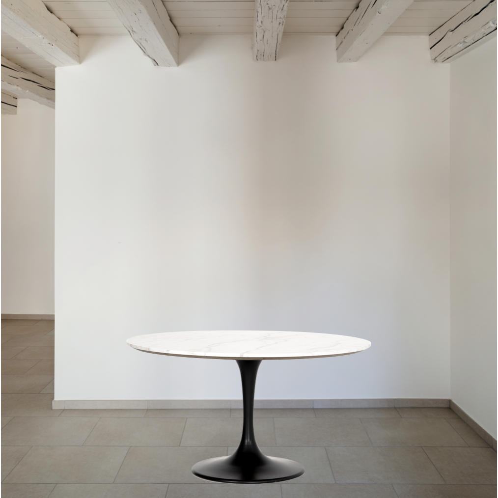 We love the mixed materials found in this Powell Dining Table - White Marble. Classic tulip shaping is recast with a rustic black iron base and rounded top of white marble - a perfect addition to any dining room or kitchen! Amethyst Home provides interior design, new home construction design consulting, vintage area rugs, and lighting in the Scottsdale metro area.