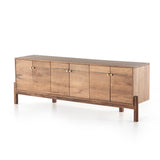 Featuring Reza Media Console - Smoked Honey by Four Hands at Amethyst Home. We love mid-century feel to this Reza Media Console - Smoked Honey. Finished in a light, smoked honey, a clean-lined parawood console sits in an arched cradle base of toasted acacia, for fresh contrast. Twist-lock metal hardware adds a clever finishing touch. Rear cutouts for media .  Amethyst Home provides interior design, new home construction design consulting, vintage area rugs, and lighting in the Portland metro area.
