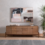 Featuring Reza Media Console - Smoked Honey by Four Hands at Amethyst Home. We love mid-century feel to this Reza Media Console - Smoked Honey. Finished in a light, smoked honey, a clean-lined parawood console sits in an arched cradle base of toasted acacia, for fresh contrast. Twist-lock metal hardware adds a clever finishing touch. Rear cutouts for media cor.  Amethyst Home provides interior design, new home construction design consulting, vintage area rugs, and lighting in the Tampa metro area.