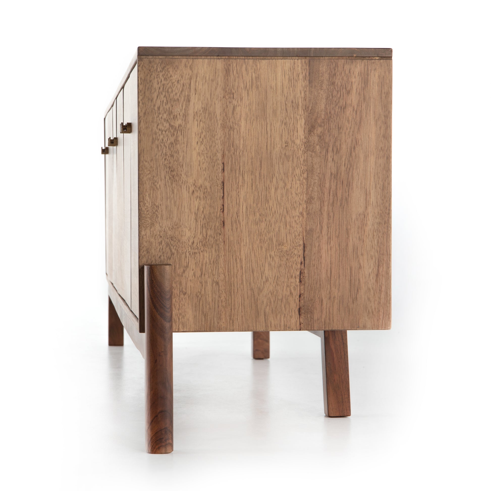 We love mid-century feel to this Reza Media Console - Smoked Honey. Finished in a light, smoked honey, a clean-lined parawood console sits in an arched cradle base of toasted acacia, for fresh contrast. Twist-lock metal hardware adds a clever finishing touch. Rear cutouts for media cord management.  Overall Dimensions: 84.00"w x 18.00"d x 28.25"h