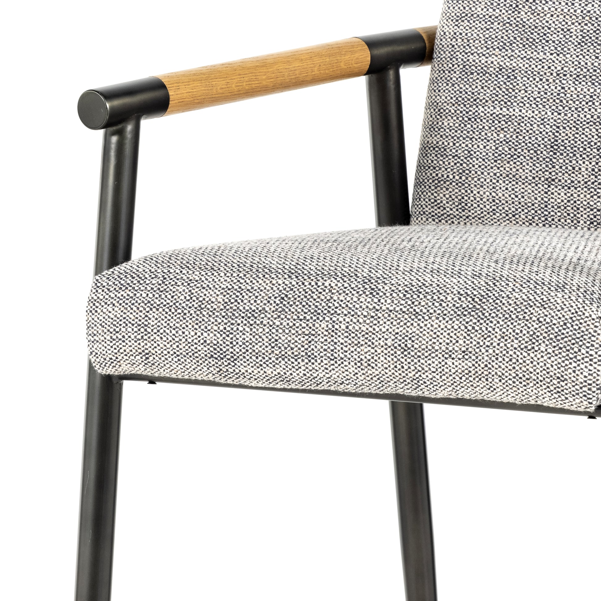 We love the textural grey seating upholstered in a high-performance fabric on this Rowen Bar + Counter Stool - Thames Raven. The angular solid oak arms and black-finished stainless steel framing is perfectly sized to elevate your bar or counter space. 