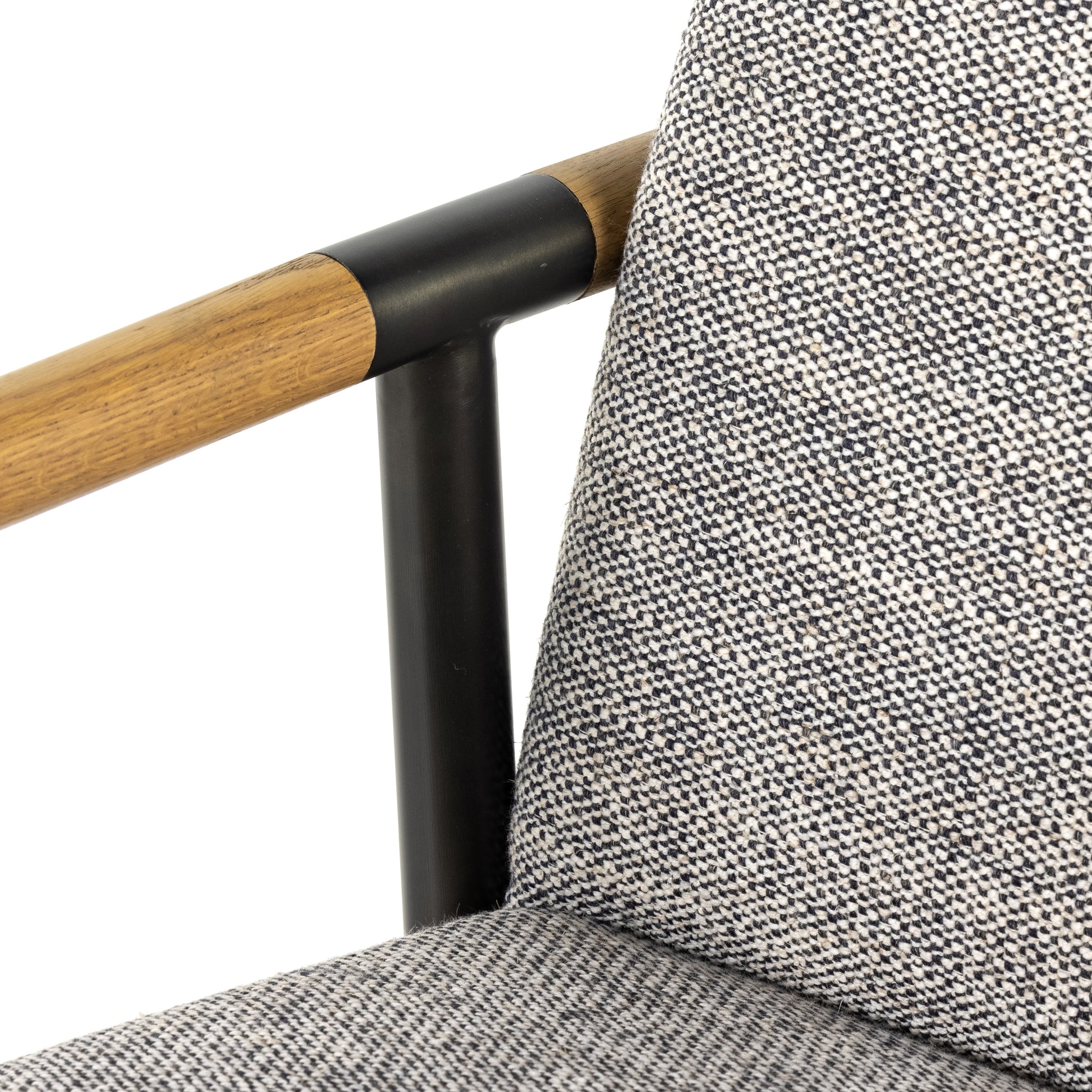We love the textural grey seating upholstered in a high-performance fabric on this Rowen Bar + Counter Stool - Thames Raven. The angular solid oak arms and black-finished stainless steel framing is perfectly sized to elevate your bar or counter space. 