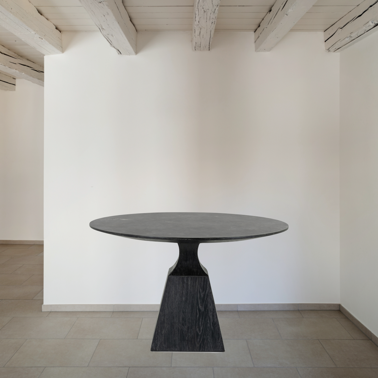 Featuring Sargon Dining Table - Bluestone by Four Hands at Amethyst Home. We love the unique bell shape of this Sargon Bluestone Dining Table. It brings an industrial feel to any dining room. 
Overall Dimensions: 53.25"W x 53.25"L x 30"H
Colors: Washed Black, BluestoneMaterials: Solid Oak, BluestoneWeight: 235.89 lbVolume: 28.71 cu ftClearance from Floor: 28".  Amethyst Home provides interior design, new home construction design consulting, vintage area rugs, and lighting in the Boston metro area.