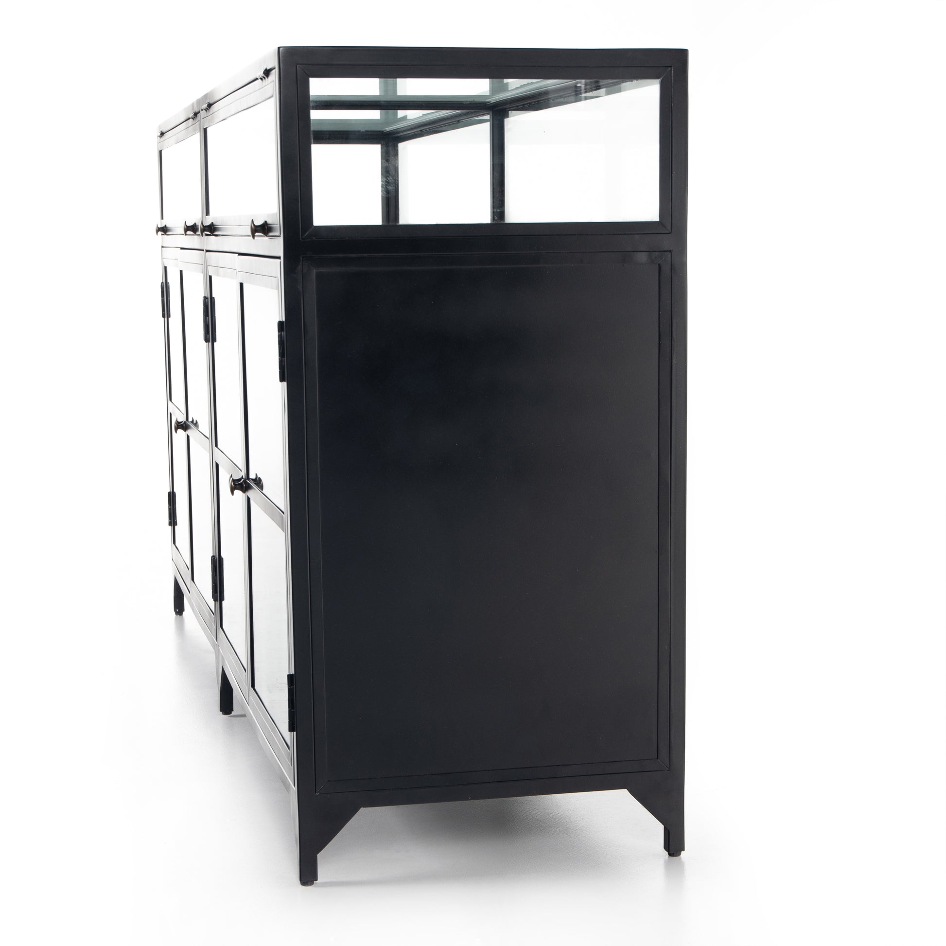 This Shadow Box Sideboard gives your inner collector a place to play. Store prized possessions behind clear glass fronts, with black-finished metal casing and brass hardware for contrast.  Overall Dimensions: 70.00"w x 17.25"d x 35.00"h