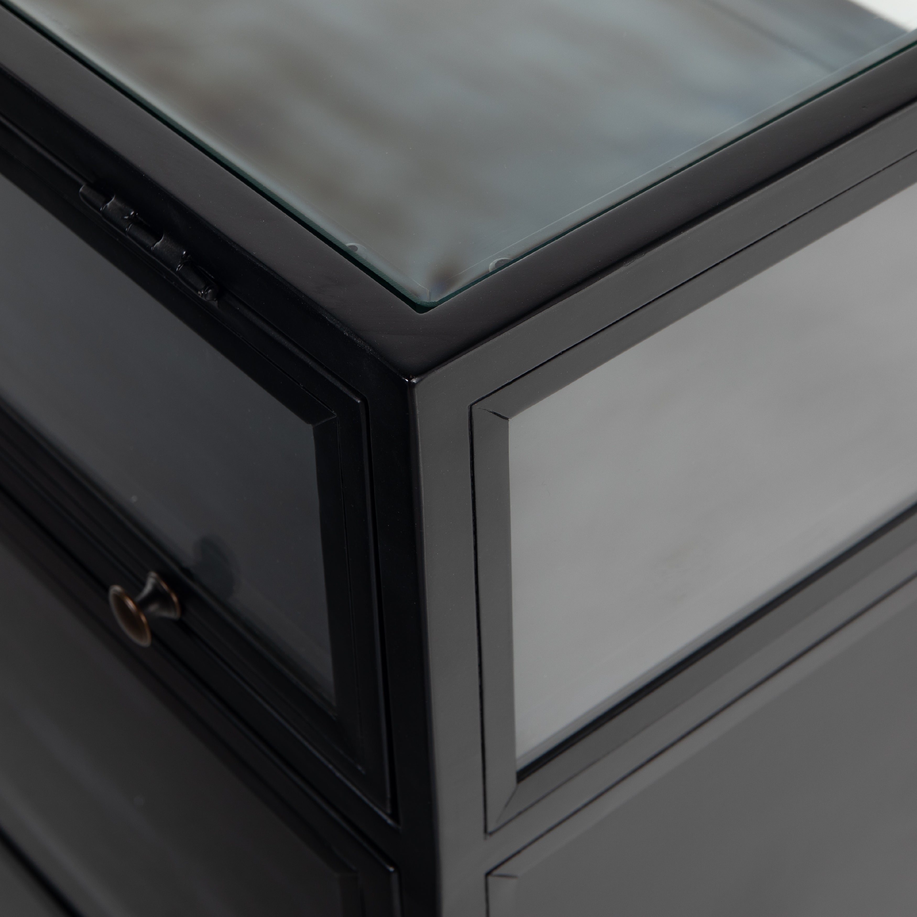 This Shadow Box Sideboard gives your inner collector a place to play. Store prized possessions behind clear glass fronts, with black-finished metal casing and brass hardware for contrast.  Overall Dimensions: 70.00"w x 17.25"d x 35.00"h
