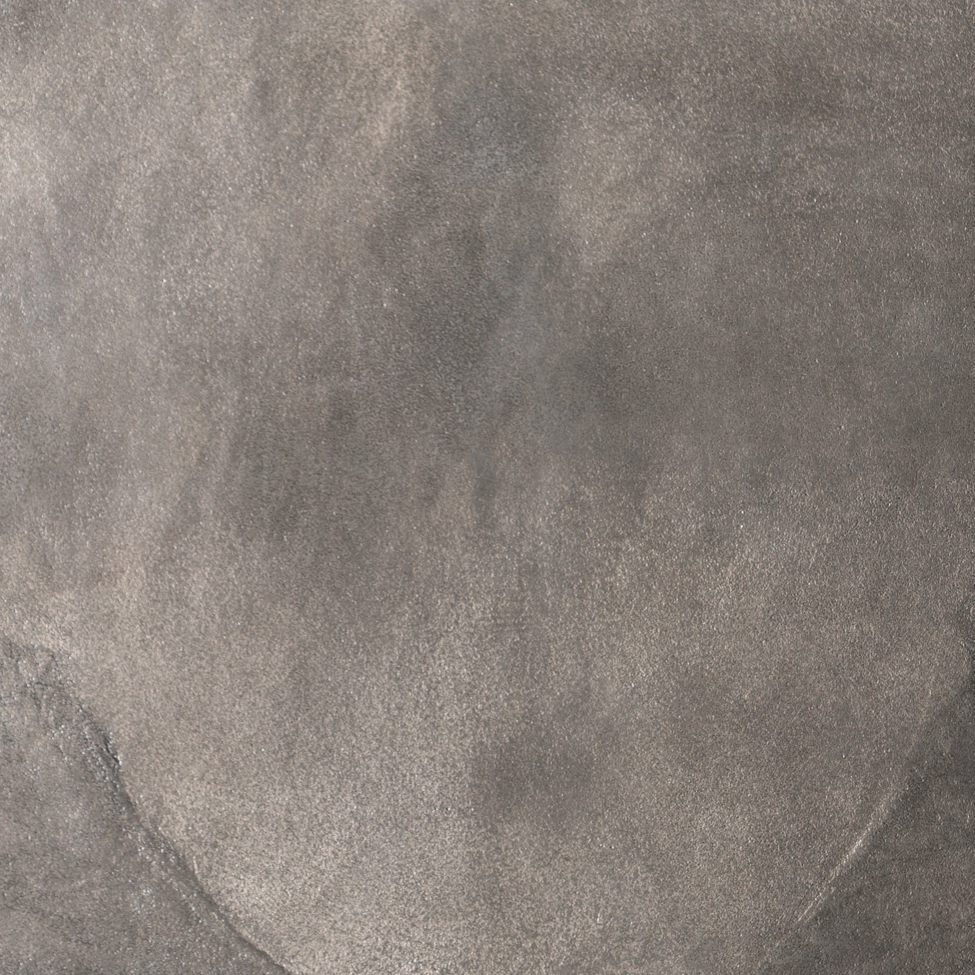 We love the oval shape of this Simone Coffee Table - Antique Nickel. The textural cast aluminum makes for a beautifully modern coffee table, with alluring highs and lows played up by a raw nickel finish. Great indoors or out; cover or store indoors during inclement weather and when not in use.  Overall Dimensions: 54.75"w x 29.25"d x 16.50"h