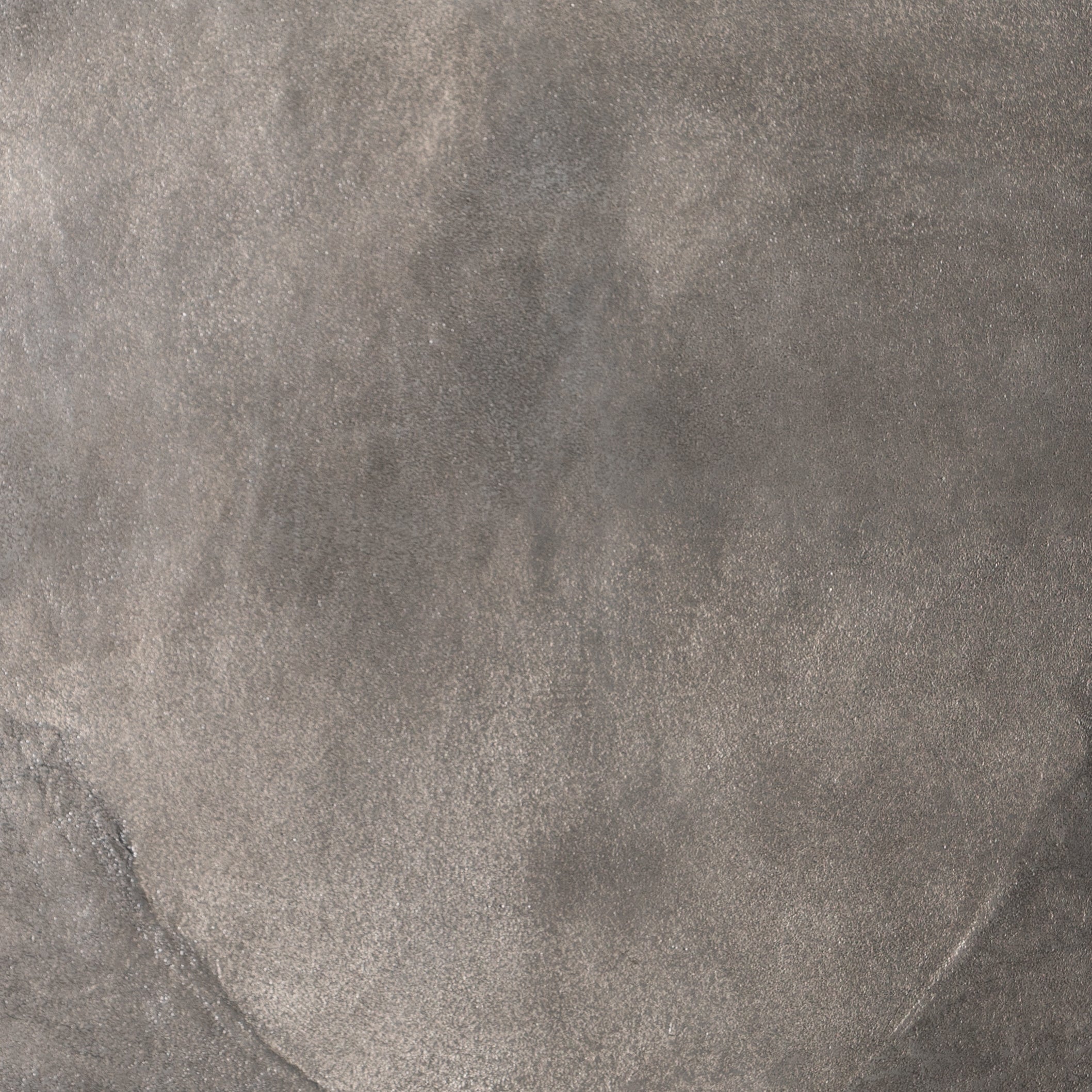 We love the oval shape of this Simone Coffee Table - Antique Nickel. The textural cast aluminum makes for a beautifully modern coffee table, with alluring highs and lows played up by a raw nickel finish. Great indoors or out; cover or store indoors during inclement weather and when not in use.  Overall Dimensions: 54.75"w x 29.25"d x 16.50"h