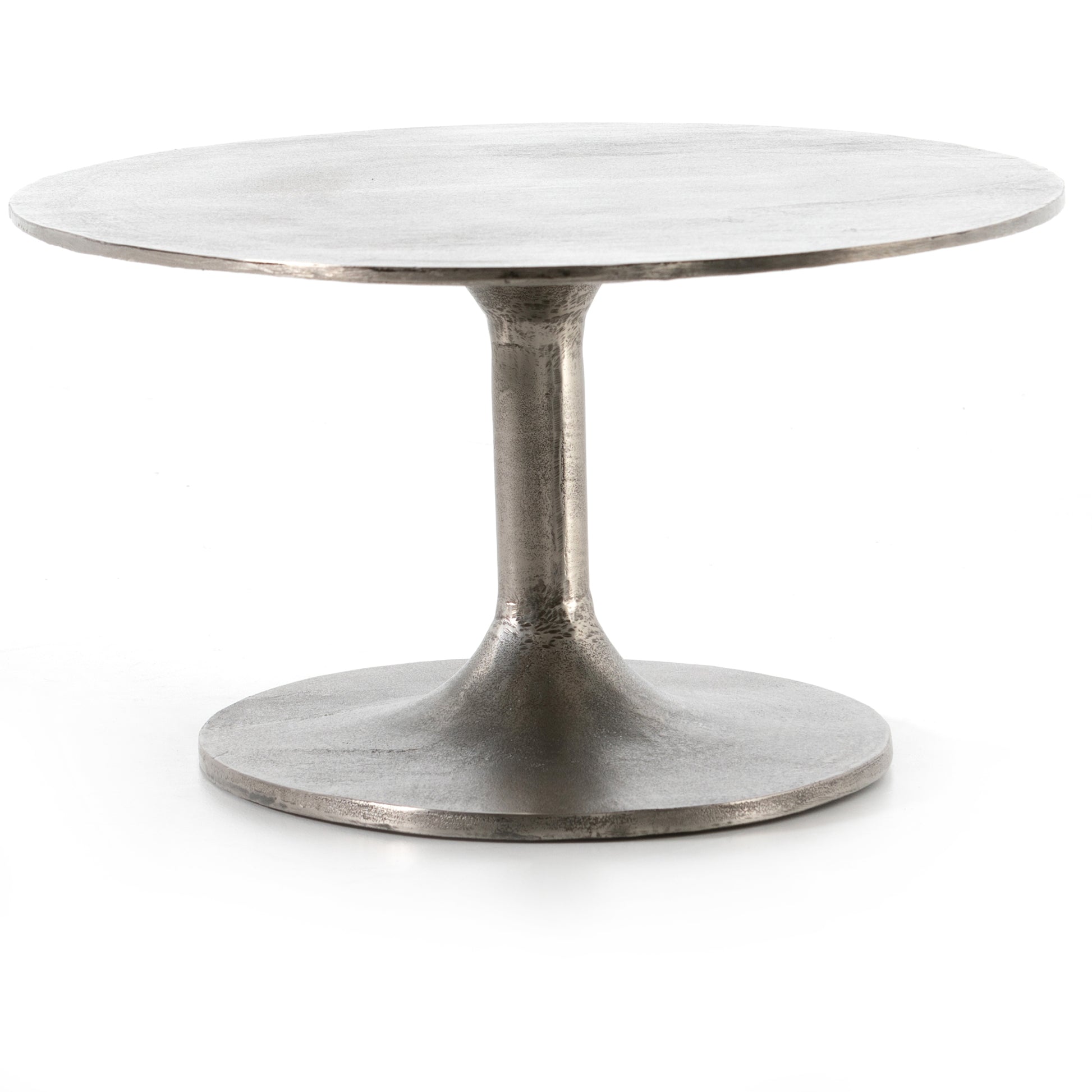 We love the oval shape of this Simone Coffee Table - Antique Nickel. The textural cast aluminum makes for a beautifully modern coffee table, with alluring highs and lows played up by a raw nickel finish. Great indoors or out; cover or store indoors during inclement weather and when not in use.  Overall Dimensions: 54.75"w x 29.25"d x 16.50"h